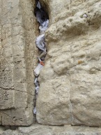 Written prayers stuffed into the crevices of the Western Wall.